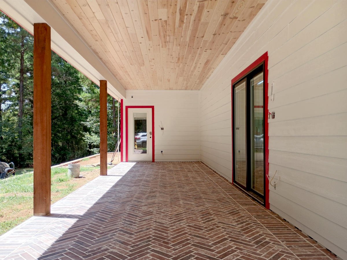 Finished flooring after a porch and bathroom remodeling project in East Texas