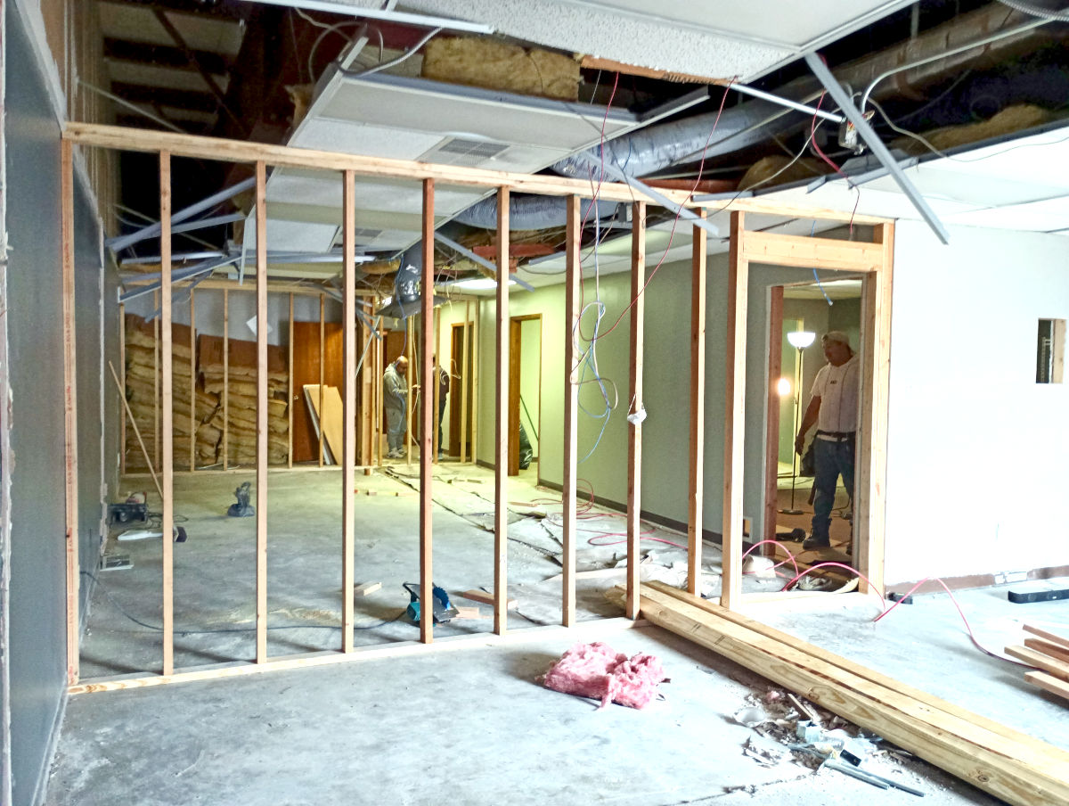 New partition wall framing with a door opening during an office build-out by commercial contractors in Tyler, TX